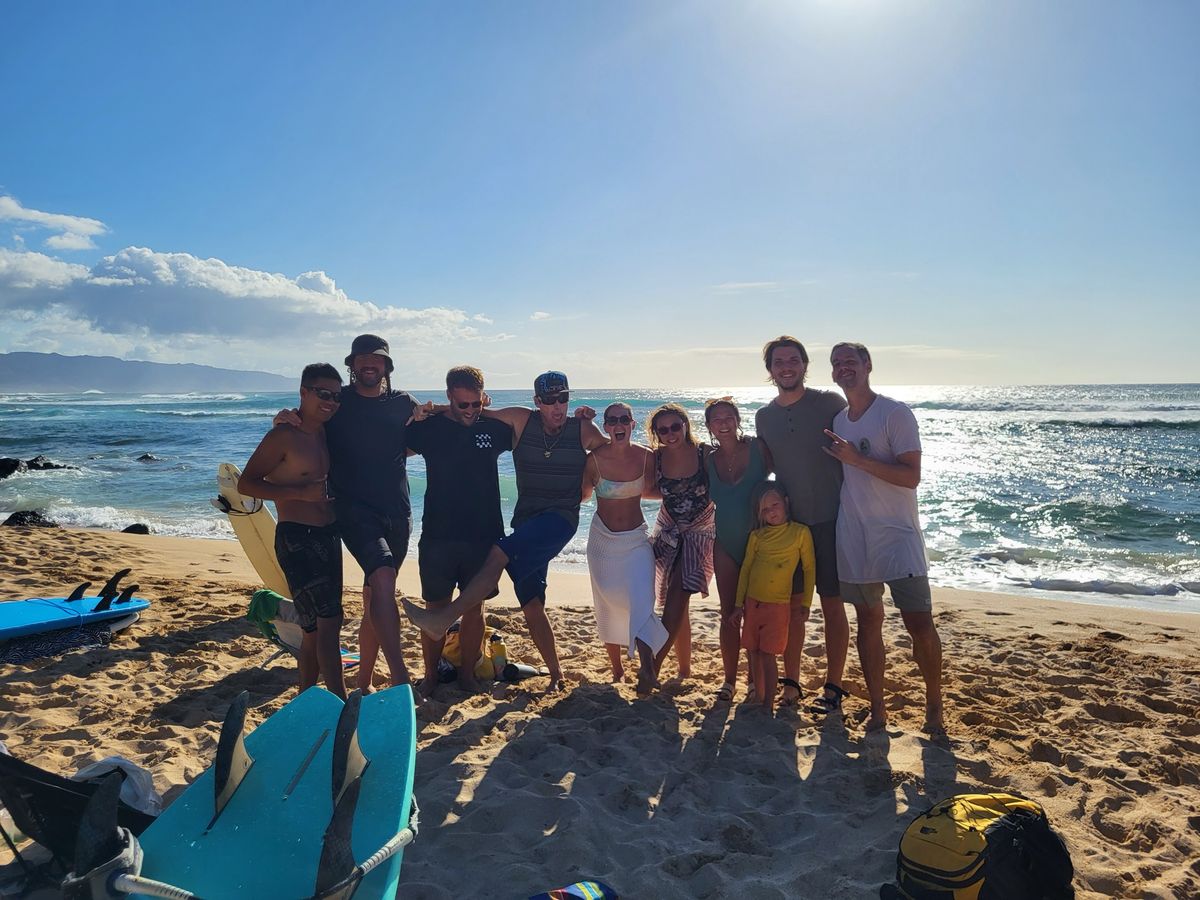 Surf lesson group smiling together on Waikīkī Beach