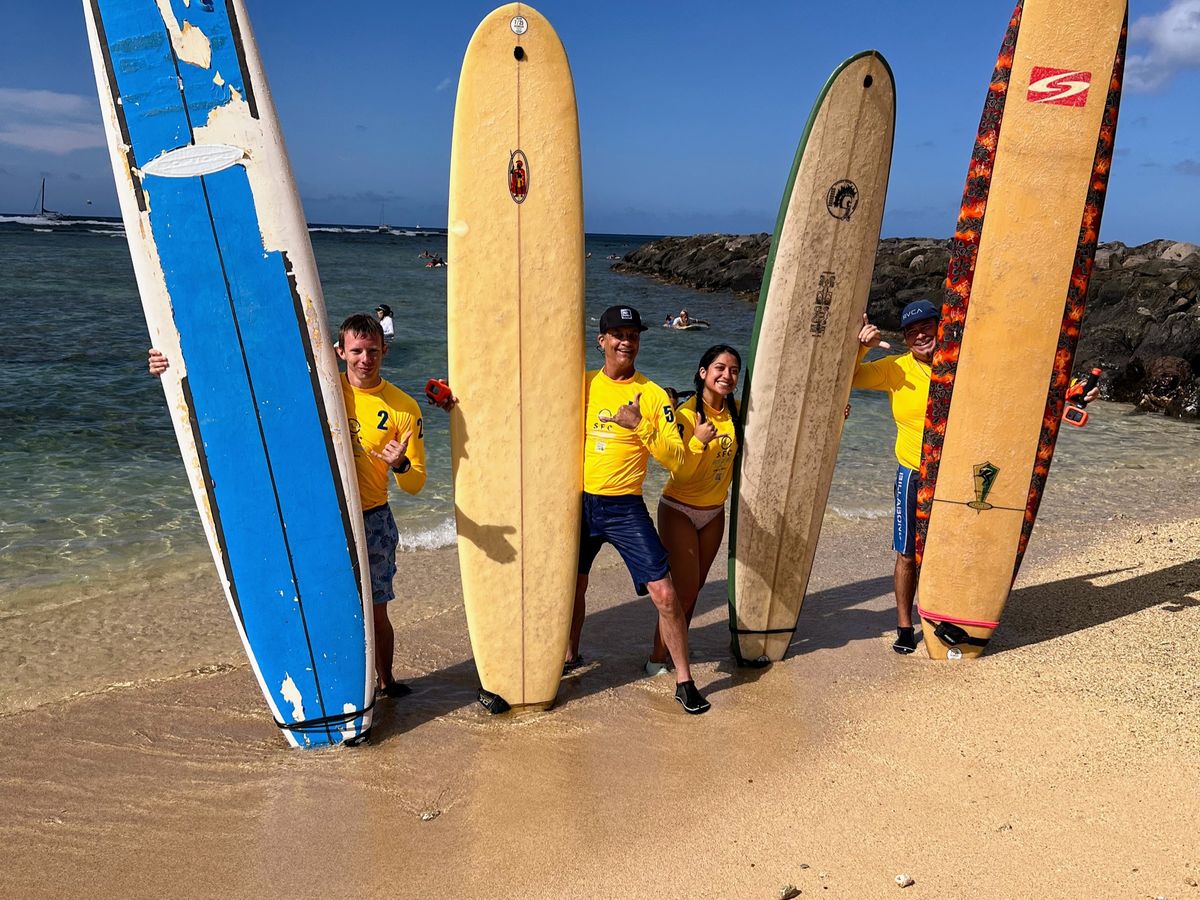 Surfboards prepared for a Waikīkī surf lesson